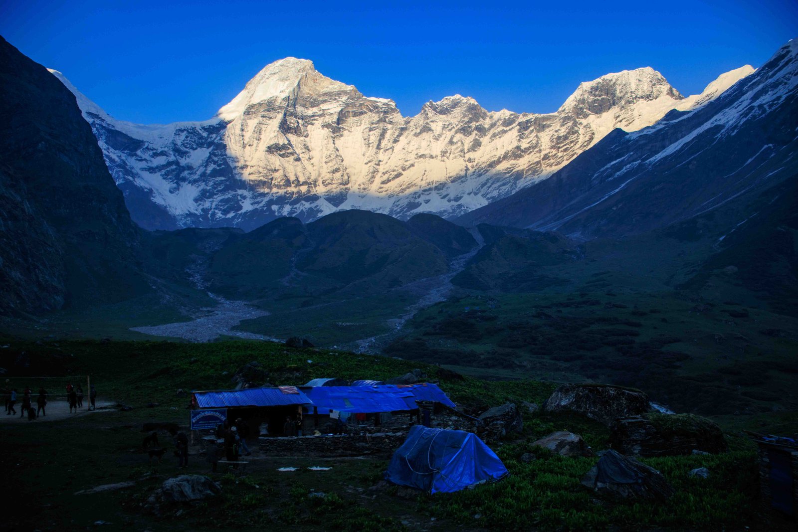 Sunset light on Bobaye peak from Api Base Camp
